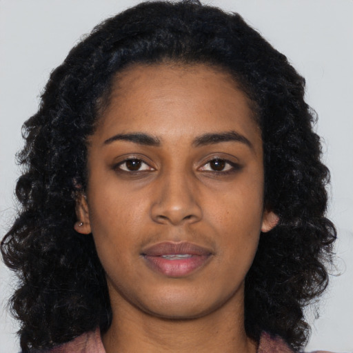 Neutral black young-adult female with long  black hair and brown eyes