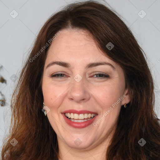 Joyful white adult female with long  brown hair and brown eyes