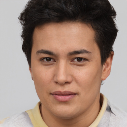 Joyful asian young-adult male with short  brown hair and brown eyes