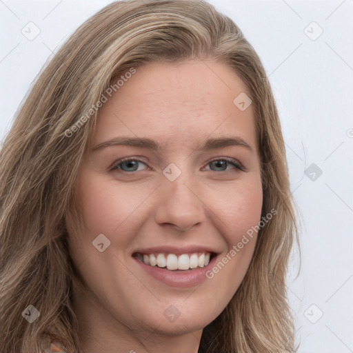 Joyful white young-adult female with long  brown hair and green eyes