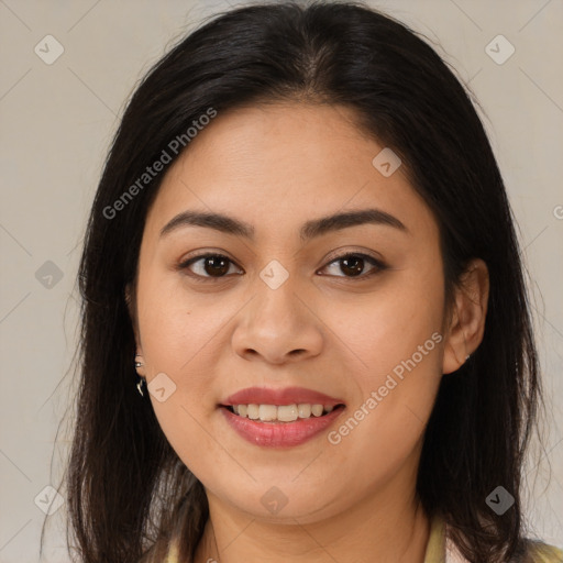 Joyful latino young-adult female with medium  brown hair and brown eyes