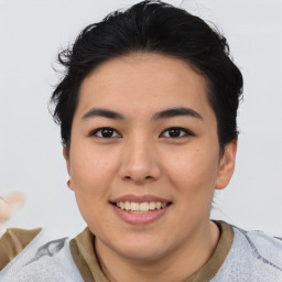 Joyful asian young-adult female with short  black hair and brown eyes