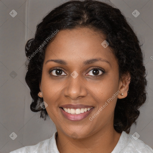 Joyful black young-adult female with medium  brown hair and brown eyes