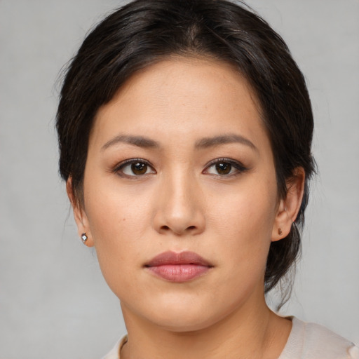 Neutral asian young-adult female with medium  brown hair and brown eyes