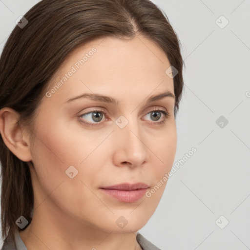 Neutral white young-adult female with medium  brown hair and brown eyes