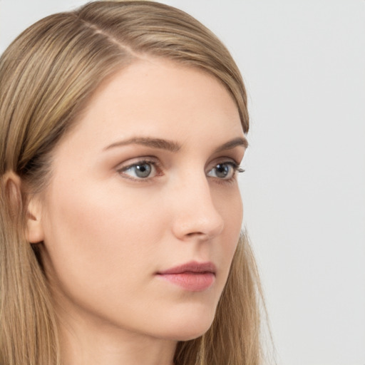 Neutral white young-adult female with long  brown hair and grey eyes