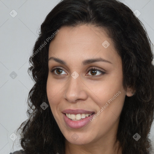 Joyful latino young-adult female with long  brown hair and brown eyes