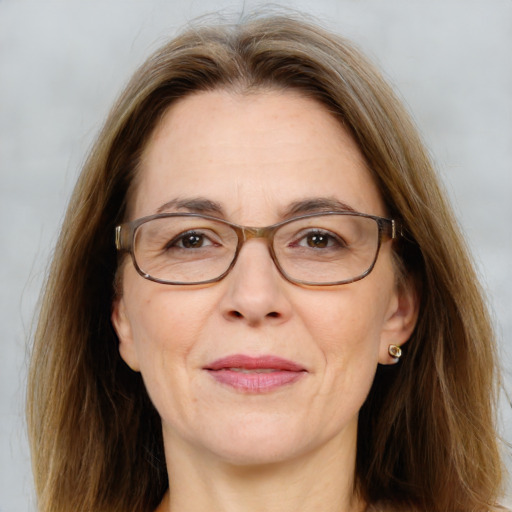 Joyful white adult female with long  brown hair and brown eyes