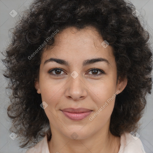 Joyful black young-adult female with medium  brown hair and brown eyes