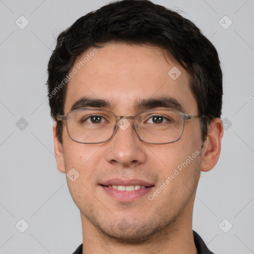 Joyful white young-adult male with short  black hair and brown eyes