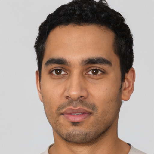 Neutral latino young-adult male with short  black hair and brown eyes