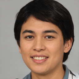 Joyful asian young-adult male with medium  brown hair and brown eyes