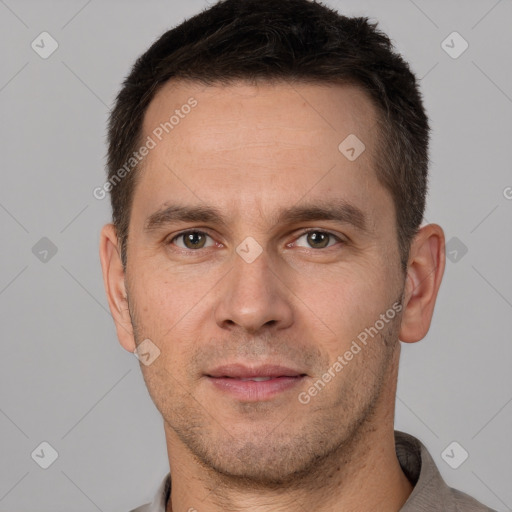 Joyful white adult male with short  brown hair and brown eyes