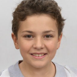 Joyful white child female with short  brown hair and brown eyes