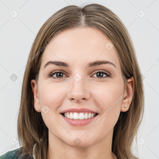 Joyful white young-adult female with long  brown hair and grey eyes