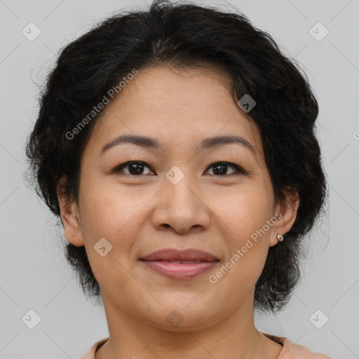 Joyful asian adult female with medium  brown hair and brown eyes