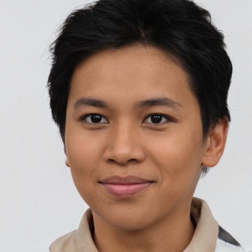 Joyful asian young-adult female with short  brown hair and brown eyes