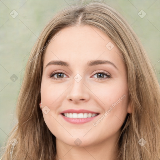 Joyful white young-adult female with long  brown hair and green eyes