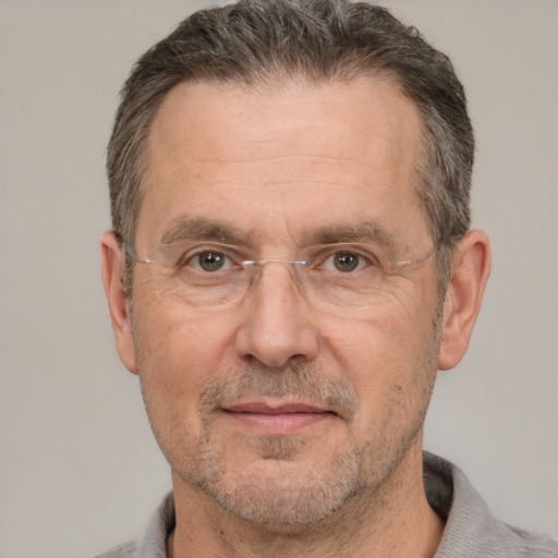 Joyful white middle-aged male with short  brown hair and brown eyes