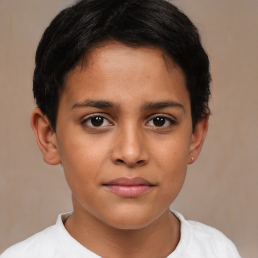 Joyful latino child female with short  brown hair and brown eyes