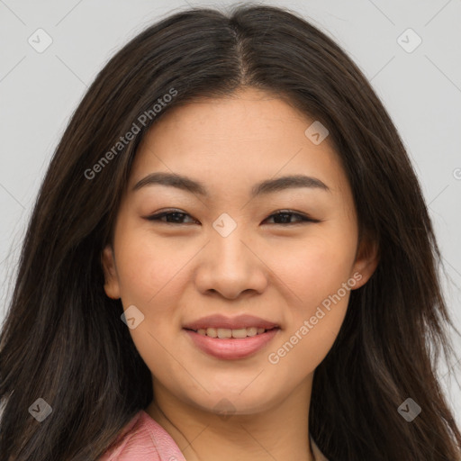 Joyful asian young-adult female with long  brown hair and brown eyes