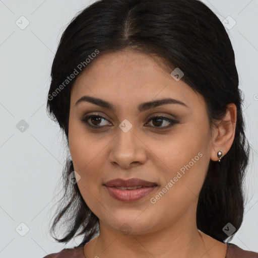 Joyful latino young-adult female with medium  brown hair and brown eyes