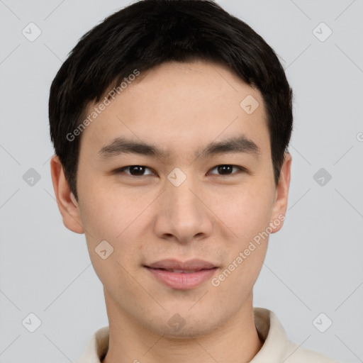 Joyful asian young-adult male with short  black hair and brown eyes