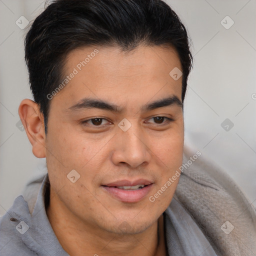 Joyful latino young-adult male with short  brown hair and brown eyes