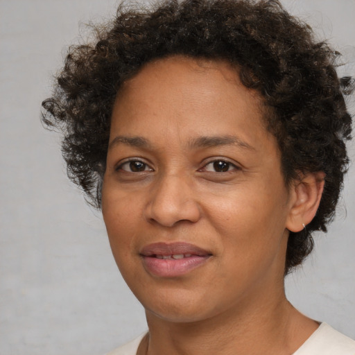 Joyful white adult female with short  brown hair and brown eyes