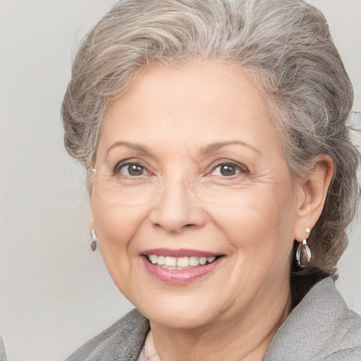 Joyful white middle-aged female with medium  brown hair and grey eyes