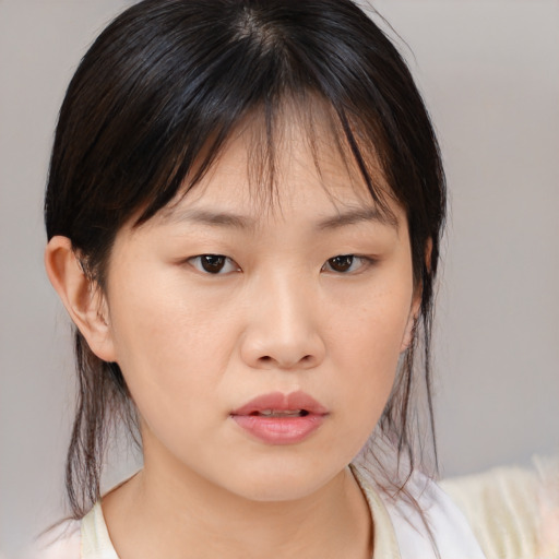 Neutral asian young-adult female with medium  brown hair and brown eyes