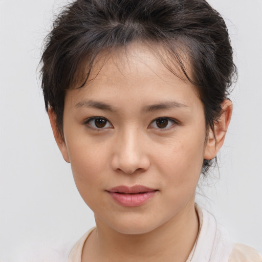 Joyful white child female with medium  brown hair and brown eyes