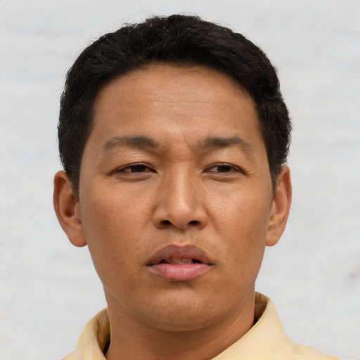 Neutral asian adult male with short  brown hair and brown eyes