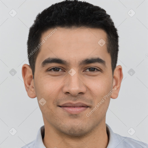 Joyful latino young-adult male with short  black hair and brown eyes