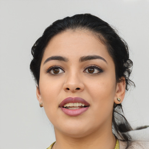 Joyful latino young-adult female with medium  black hair and brown eyes