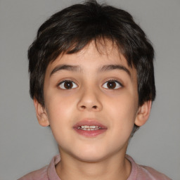 Joyful white child male with short  brown hair and brown eyes