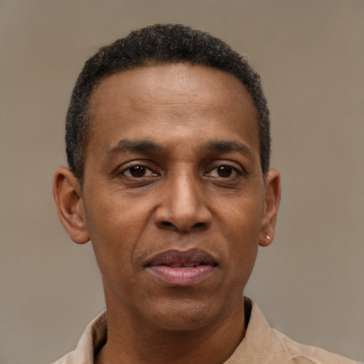Joyful latino adult male with short  black hair and brown eyes