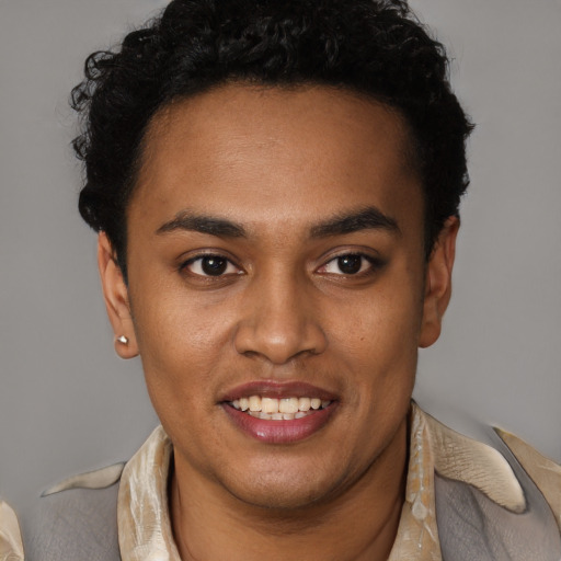 Joyful black young-adult male with short  brown hair and brown eyes