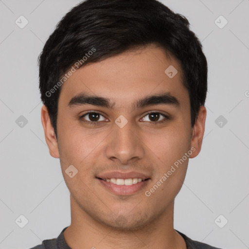 Joyful latino young-adult male with short  brown hair and brown eyes