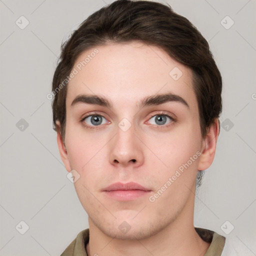 Neutral white young-adult male with short  brown hair and grey eyes