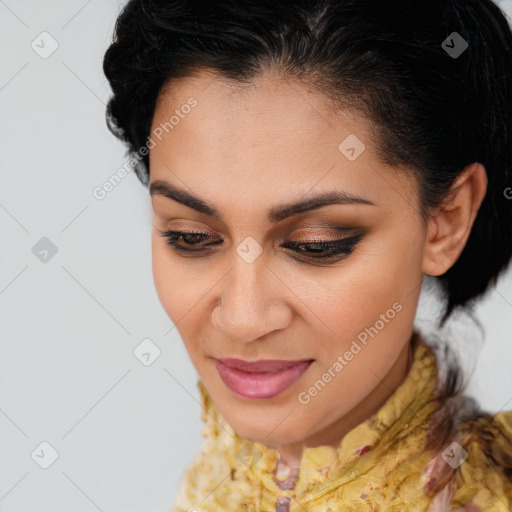 Joyful latino young-adult female with medium  brown hair and brown eyes