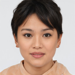 Joyful asian young-adult female with short  brown hair and brown eyes