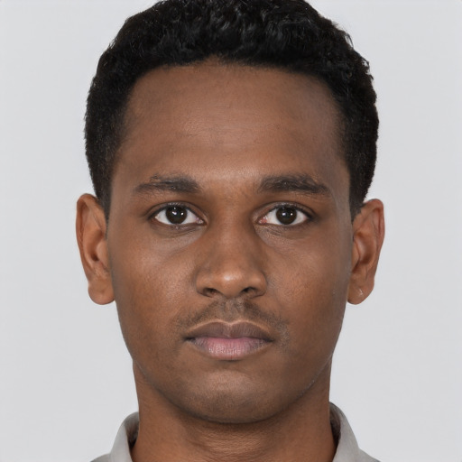 Neutral black young-adult male with short  brown hair and brown eyes