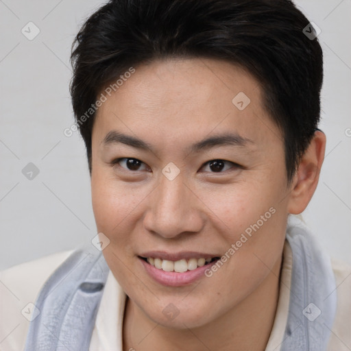 Joyful asian young-adult female with short  brown hair and brown eyes