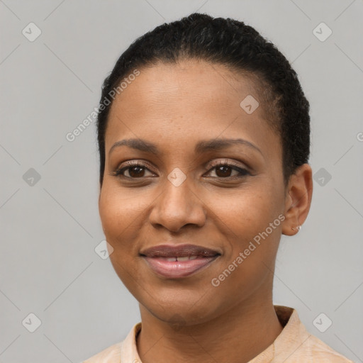 Joyful black young-adult female with short  black hair and brown eyes