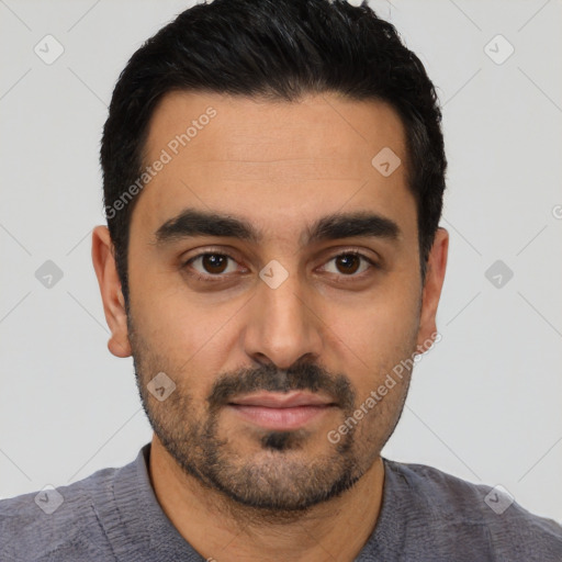 Joyful latino young-adult male with short  black hair and brown eyes