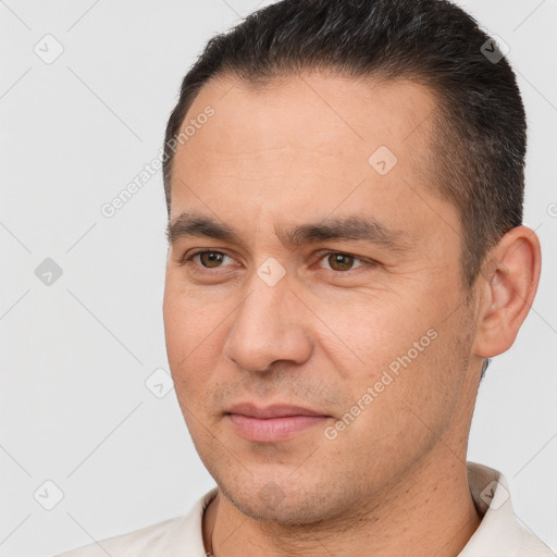 Joyful white adult male with short  brown hair and brown eyes