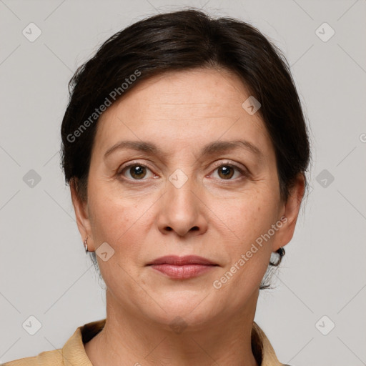 Joyful white adult female with short  brown hair and grey eyes