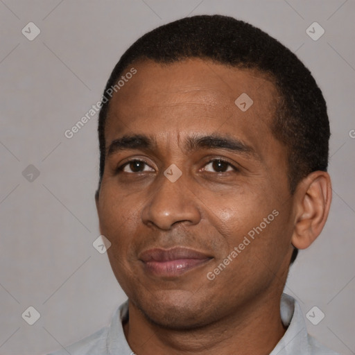Joyful black adult male with short  black hair and brown eyes