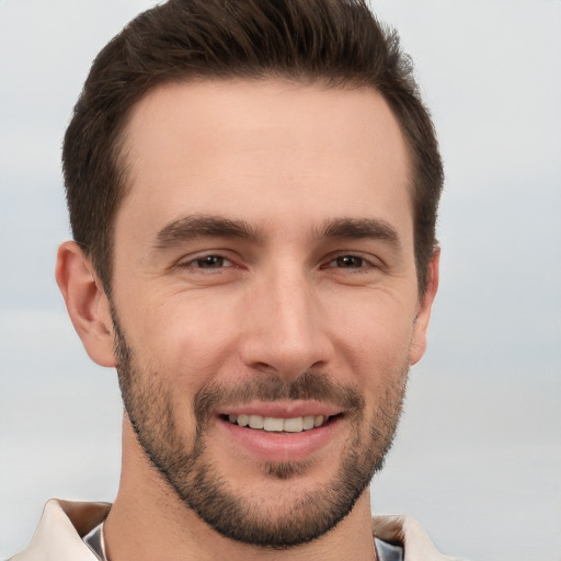 Joyful white young-adult male with short  brown hair and brown eyes